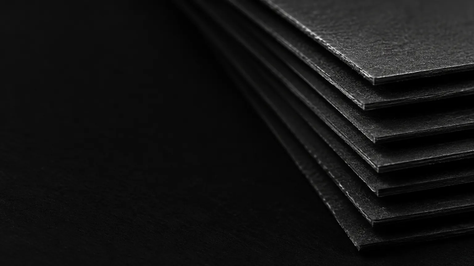 A stack of dark card, edge on.