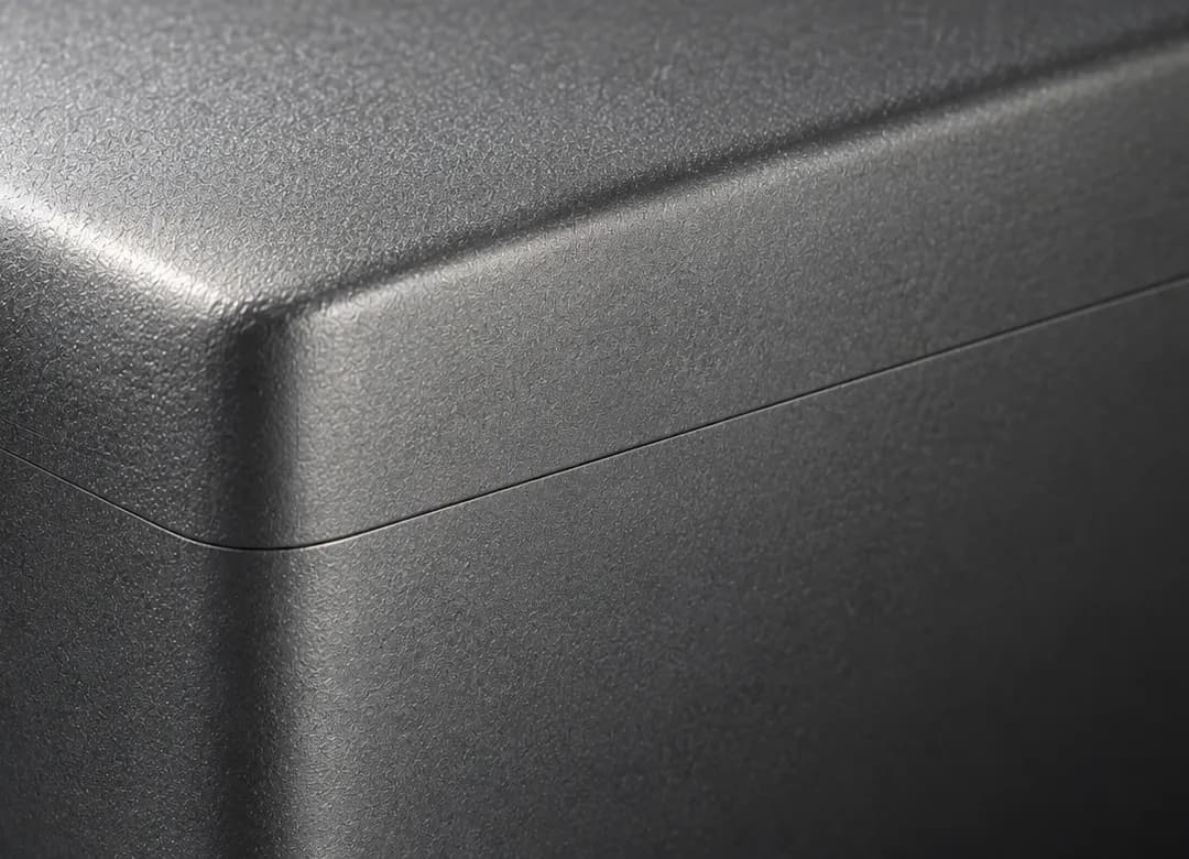 The brushed edge of a metal case.
