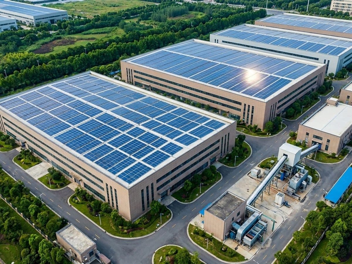 Modern industrial complex with solar panels and material recovery equipment