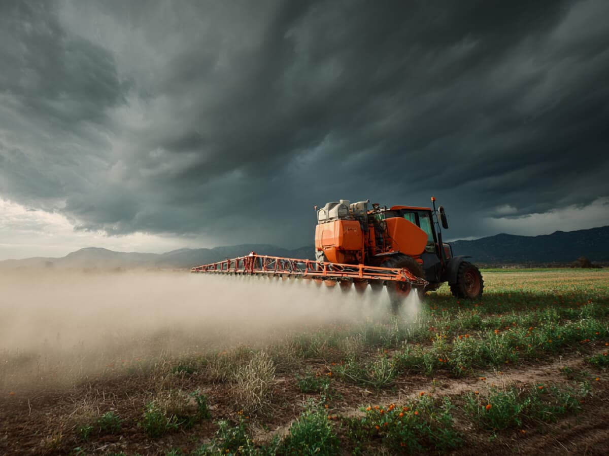 Spraying pesticides in a field