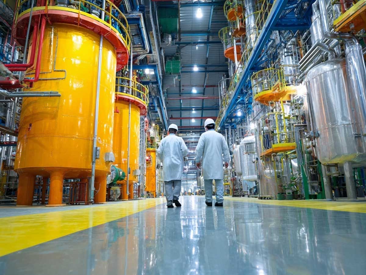People on chemical factory floor